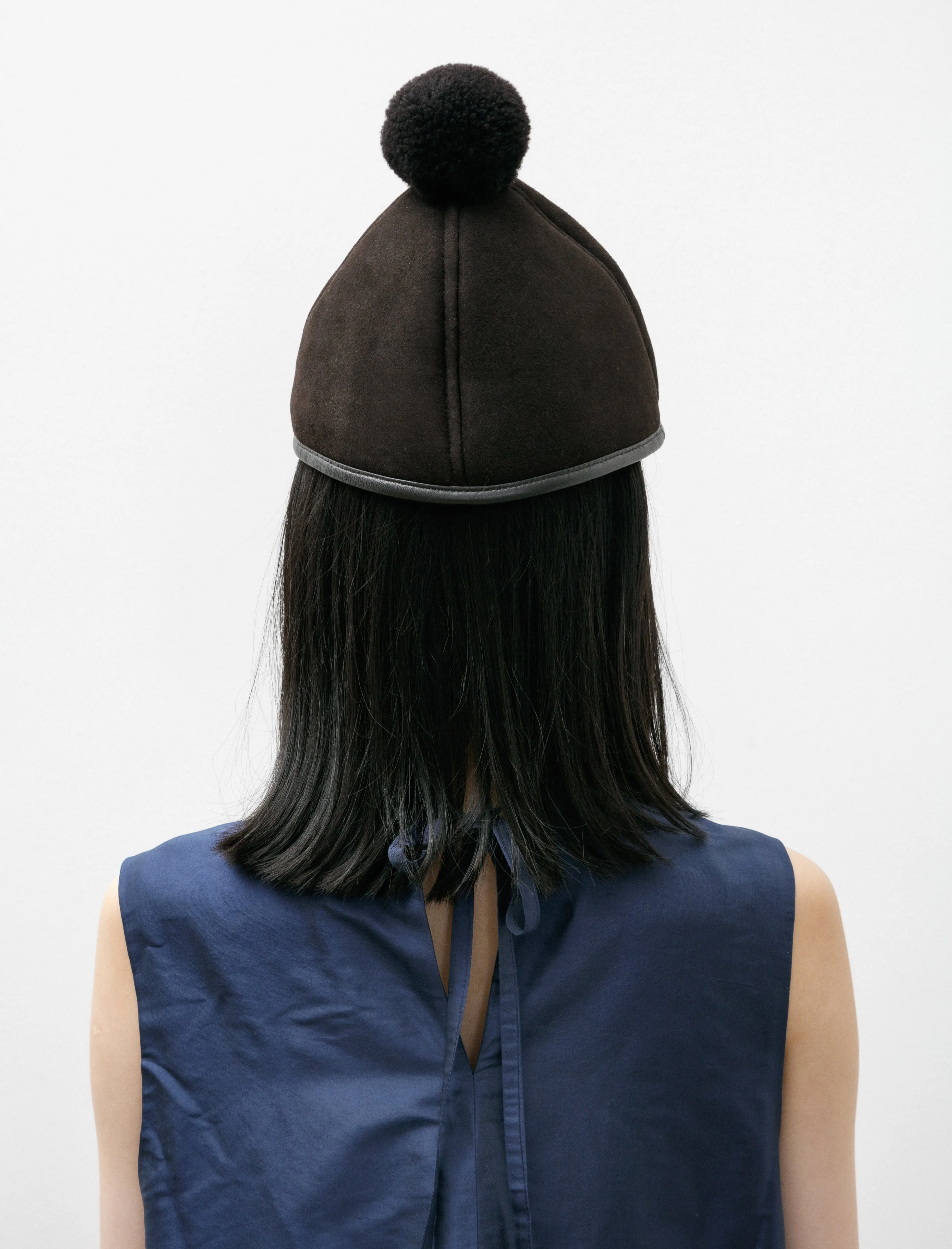 Suede Back Curly Shell Hat with Pompom